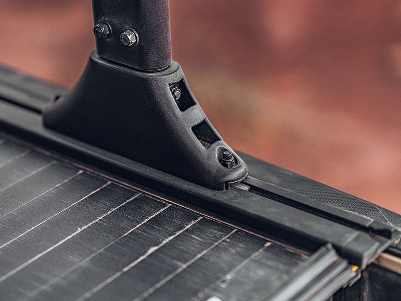 Rack foot clamped into the Roll-N-Lock A-Series XT MaxTrak rail with the slat surface in the foreground