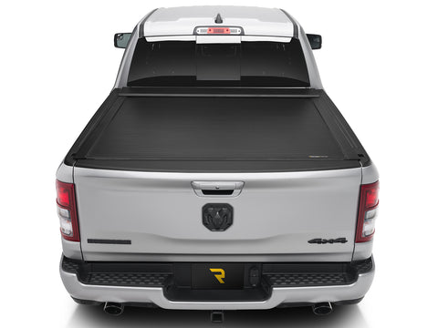 Roll-N-Lock E-Series electric cover closed over a pickup bed, straight rear view with the tailgate up