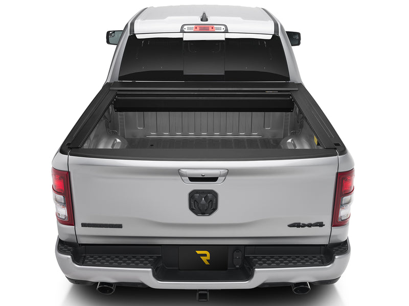Roll-N-Lock E-Series fully retracted into its canister, straight rear view of the open bed