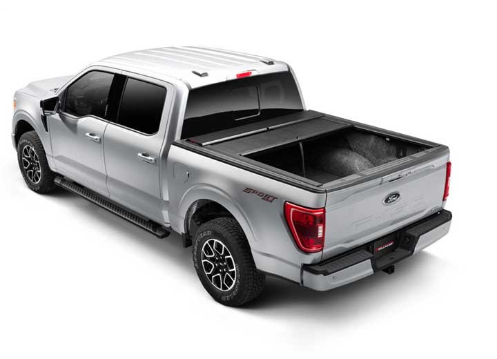 Roll-N-Lock M-Series retracted halfway on a 2021 Ford F-150, rear three-quarter view
