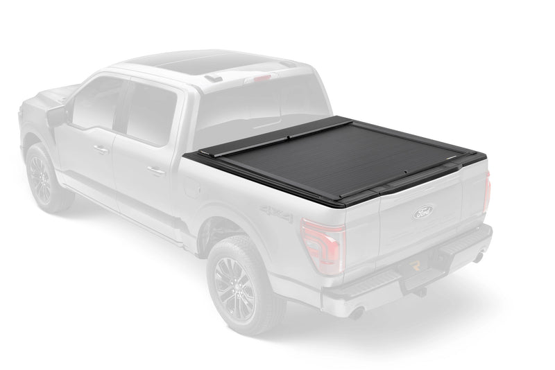 Roll-N-Lock M-Series shown fitted to a ghosted pickup, rear three-quarter view