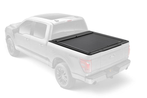 Roll-N-Lock M-Series retractable cover closed over a pickup bed, ghosted truck so the black cover stands out
