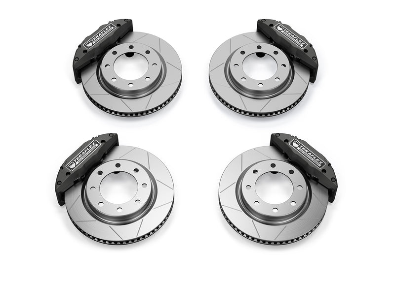 TeraFlex Brake Component, shown on a studio background: four slotted rotors with black TeraFlex High Modulus Bridge calipers on white
