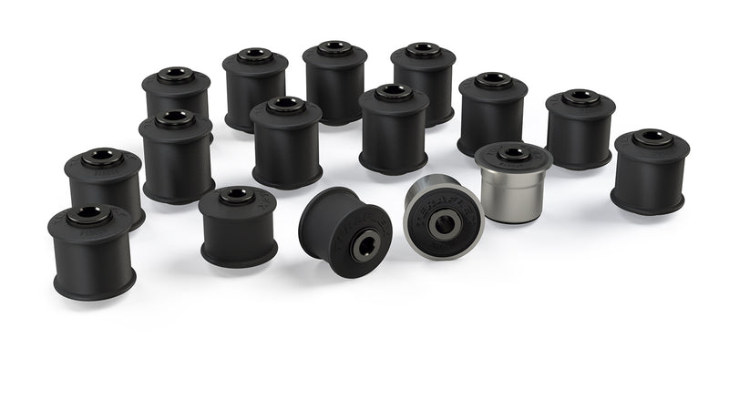 TeraFlex IR Bushing Kit, shown on a studio background: sixteen black TeraFlex control arm bushings, one silver-sleeved, on white