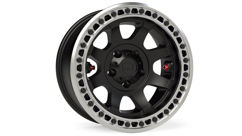 TeraFlex Off-Road Wheel, shown on a studio background: matte black 5-lug wheel with machined bolted beadlock ring, red valve stems and TeraFlex cap on white