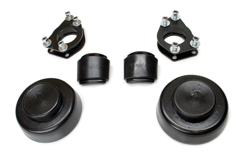TeraFlex Performance Spacer Lift Kit, shown on a studio background: photo of black strut spacers, TeraFlex-molded bump stops and coil spacers on white