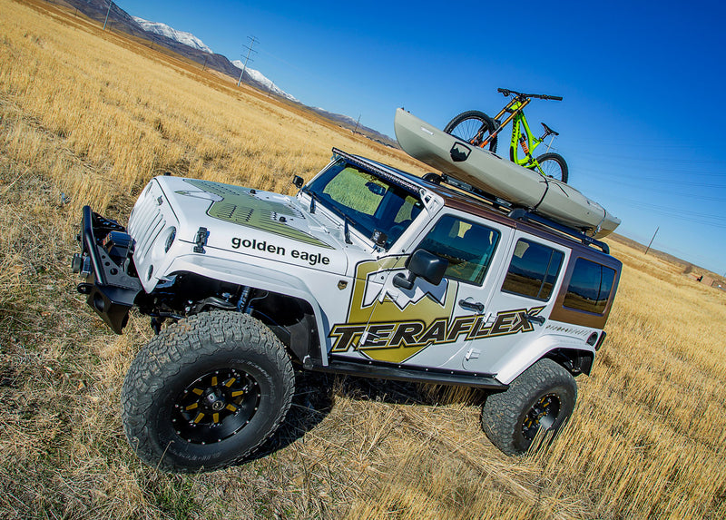 Jeep Wrangler JK Unlimited with TeraFlex livery carrying a bike and kayak on a TeraFlex Nebo roof rack
