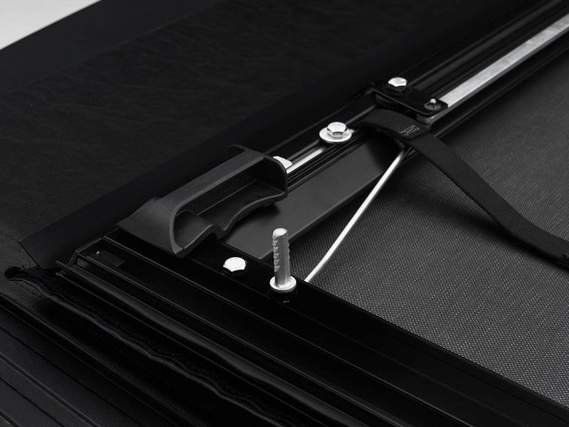 Close-up of the front section hardware and tension cable along the side rail