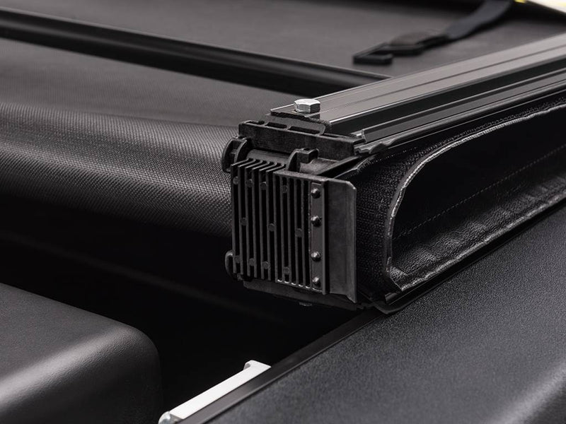 Close-up of the rolled cover end resting on the low-profile side rail