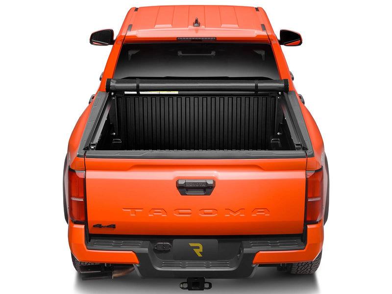 Lo Pro cover rolled up against the cab with the tailgate end of the bed fully open, view from above and behind