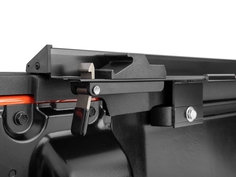 Lo Pro rail clamp and rear latch mounted inside the bed, close-up