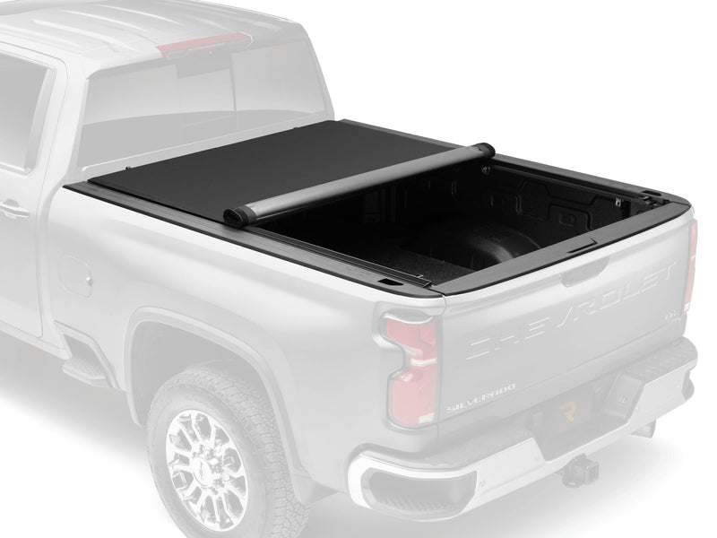 Soft roll-up cover rolled partway, rear of the bed open, on a pickup shown in faded ghost style to highlight the cover