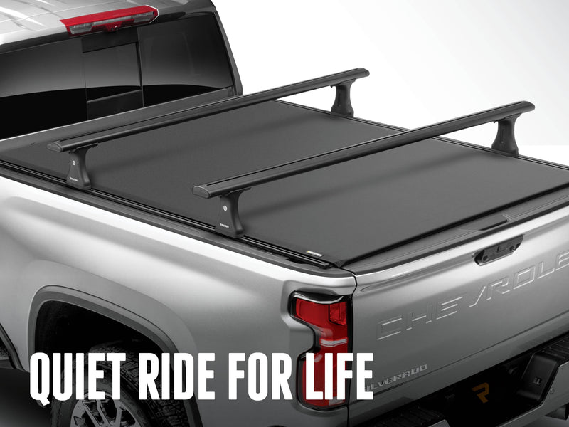 Pro X15 TS closed on a silver pickup, with the text Quiet ride for life; the roof-style crossbars are an accessory sold separately