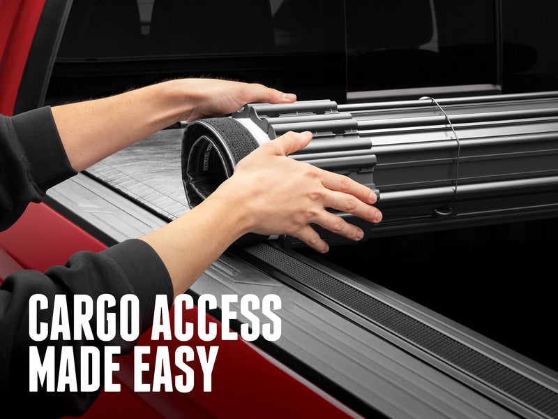 Hands rolling the Sentry cover forward along the side rails, with the text Cargo access made easy