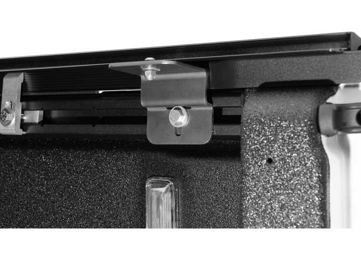 Close-up of the clamp hardware on a TruXedo Sentry CT hard roll-up tonneau cover