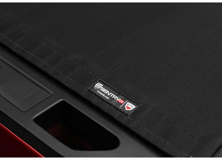Close-up of the side rail on a TruXedo Sentry CT hard roll-up tonneau cover