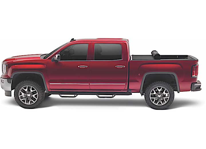 TruXedo Sentry CT hard roll-up tonneau cover rolled partway open over the bed of a pickup truck, side profile