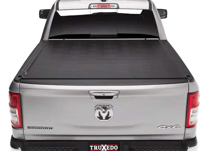 TruXedo Sentry hard roll-up tonneau cover closed on a 2019-2024 Ram 1500, straight rear view, close on the tailgate