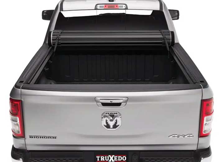 TruXedo Sentry hard roll-up tonneau cover rolled forward to the cab on a 2019-2024 Ram 1500