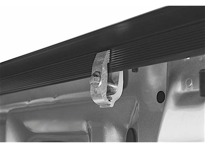 Close-up of the clamp hardware on a TruXedo Sentry hard roll-up tonneau cover