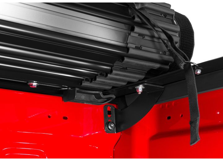 Close-up of the header rail at the tailgate on a TruXedo Sentry hard roll-up tonneau cover