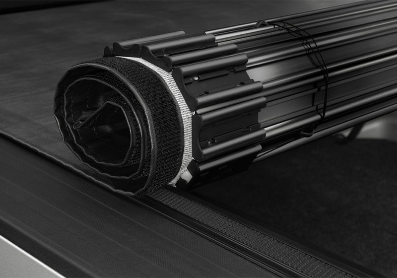 Close-up of the latch and tensioning mechanism on a TruXedo Sentry hard roll-up tonneau cover