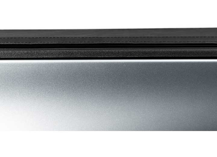 Close-up of the side rail on a TruXedo Sentry hard roll-up tonneau cover