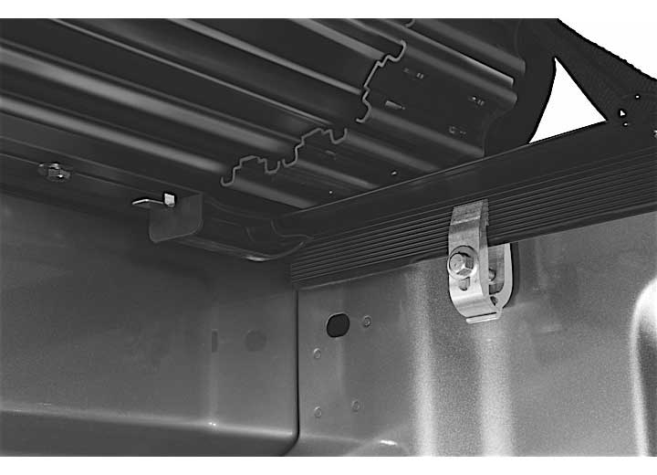 Close-up of the release lever at the rear corner on a TruXedo Sentry hard roll-up tonneau cover