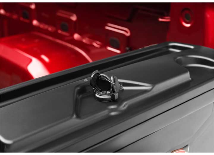 Close crop of the UnderCover SwingCase key-lockable rotary latch set into the molded lid of the toolbox