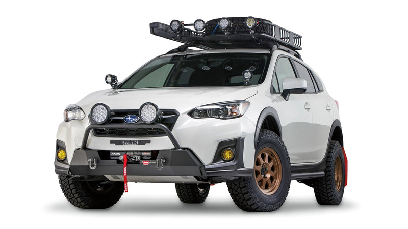 Warn Semi-Hidden Winch Mount and Grille Guard Tube on a 2018-2023 Subaru Crosstrek, with a winch and lights fitted