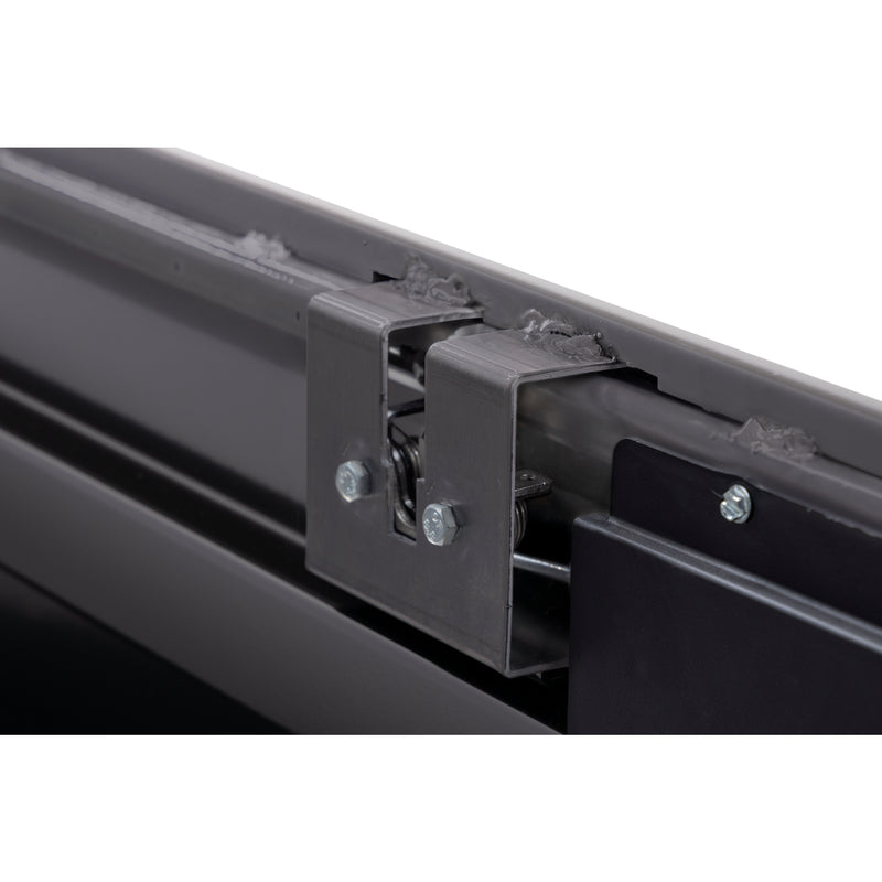 Weather Guard 120-5-04 crossover saddle box in gloss black, close-up of the rotary latch and locking mechanism inside the body