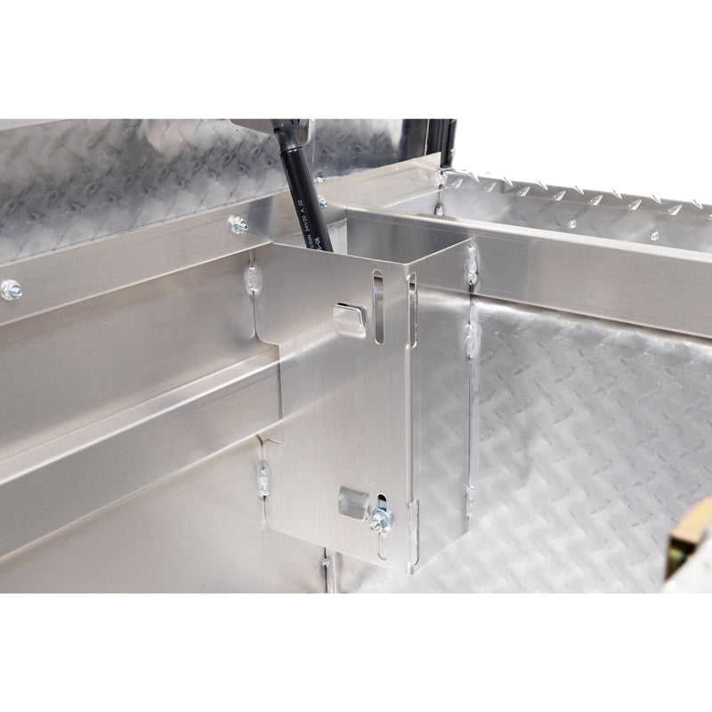 Weather Guard 121-0-04 crossover saddle box in bright aluminum diamond plate, close-up of the welded gas strut shield inside the body