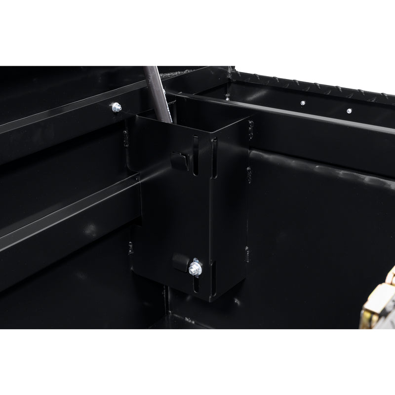 Weather Guard 121-5-04 crossover saddle box in gloss black, close-up of the welded gas strut shield inside the body