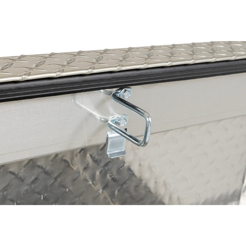 Weather Guard 127-0-04 crossover saddle box in bright aluminum diamond plate, close-up of the latch striker plate