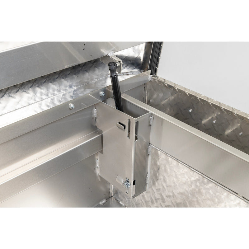 Weather Guard 127-0-04 crossover saddle box in bright aluminum diamond plate, close-up of the welded gas strut shield inside the body