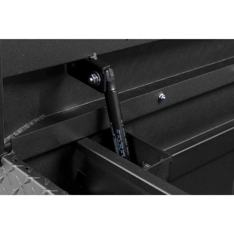 Weather Guard 127-52-04 crossover saddle box in textured matte black, close-up of the gas strut holding the lid open