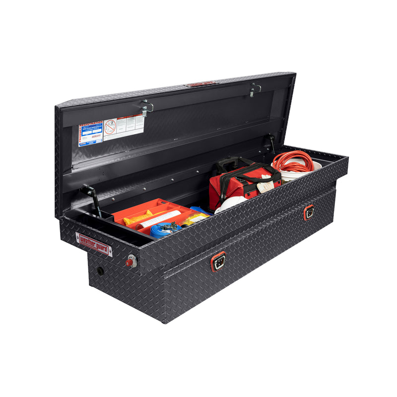 Weather Guard 127-6-04 crossover saddle box in gunmetal gray, staged open with hand tools inside to show how the usable space loads