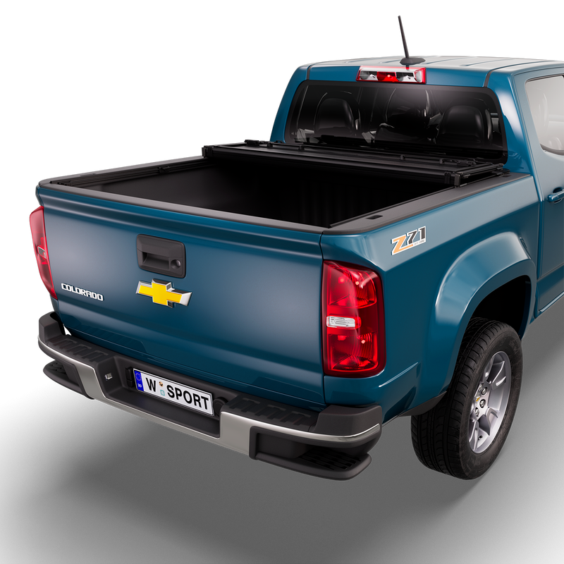 Worksport NEXUS hard folding tonneau cover on a pickup: 3D studio render of a blue Chevrolet Colorado from the rear quarter with a black NEXUS hard folding tonneau cover folded twice into a stack at the cab end, most of the bed open