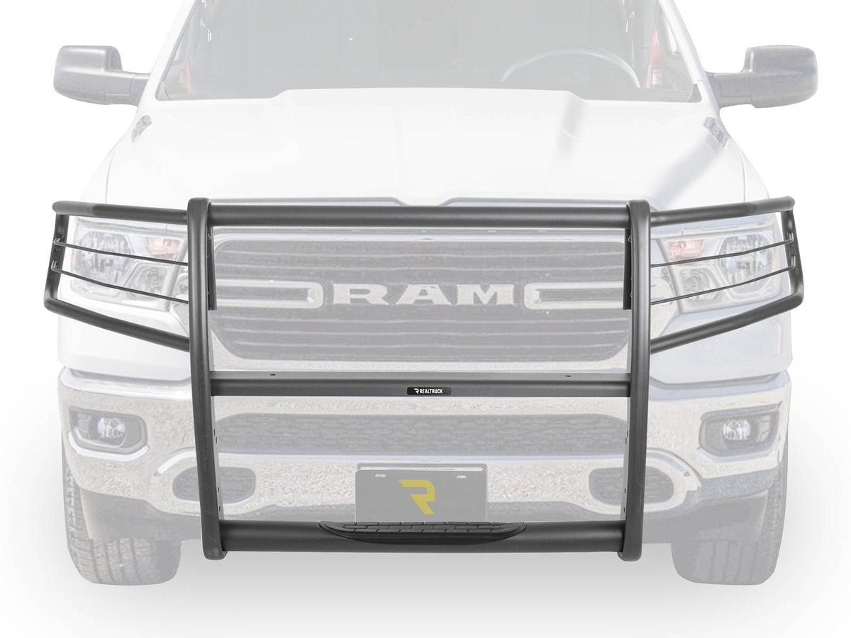 Black Go Rhino 3100 Series StepGuard with headlight brush guards on a white Ram 1500