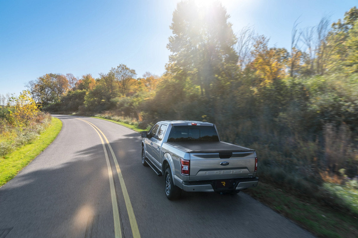 Gray 2020 Ford F-150 fitted with a BAK Revolver X4s hard roll-up tonneau cover