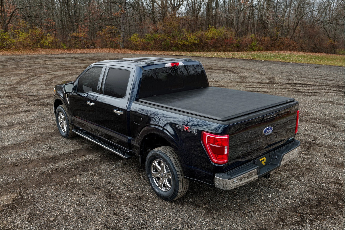 Blue 2021 Ford F-150 with an Extang Trifecta 2.0 soft folding cover on the bed