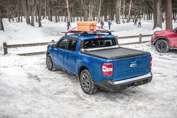 Roll-N-Lock M-Series retractable cover on a blue 2022 Ford Maverick in the snow