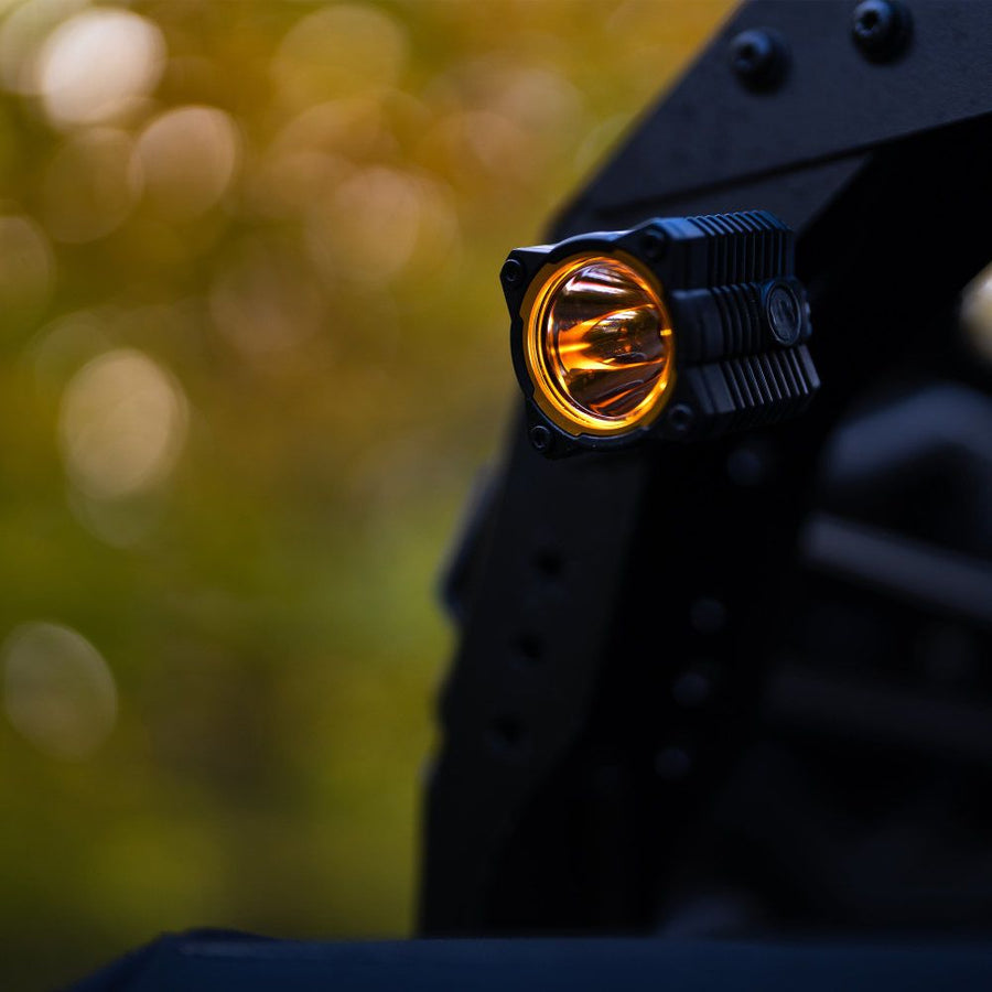 KC HiLiTES FLEX ERA 1 LED Light Pod Master Kit, FLEX ERA 1 pod with yellow bezel ring mounted on a rack bracket