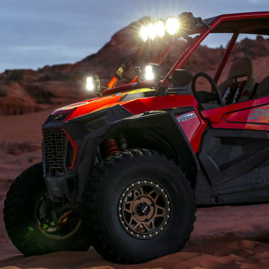 KC HiLiTES FLEX ERA 4 LED Light Pod Master Kit, red UTV with FLEX ERA 4 lights on the roof
