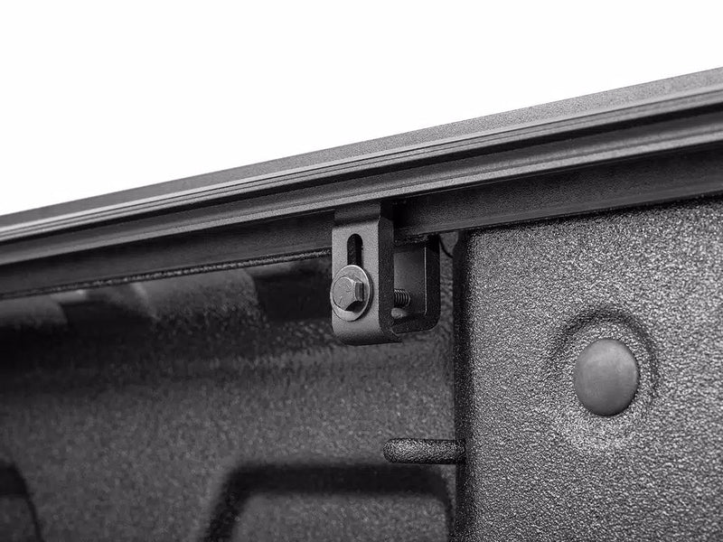 Close-up of the Select side rail and clamp bolt seen from inside the bed.