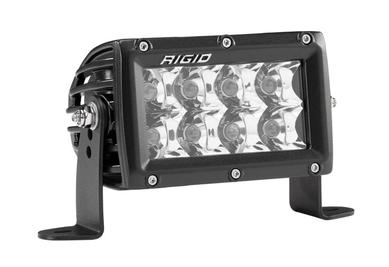 Rigid E-Series PRO 4" with spot optics and clear lens, angled view on white