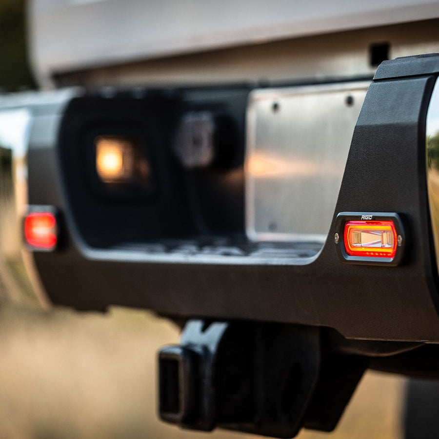Rigid SR-L Series Spreader Flush Mount with red halo lit in a rear bumper
