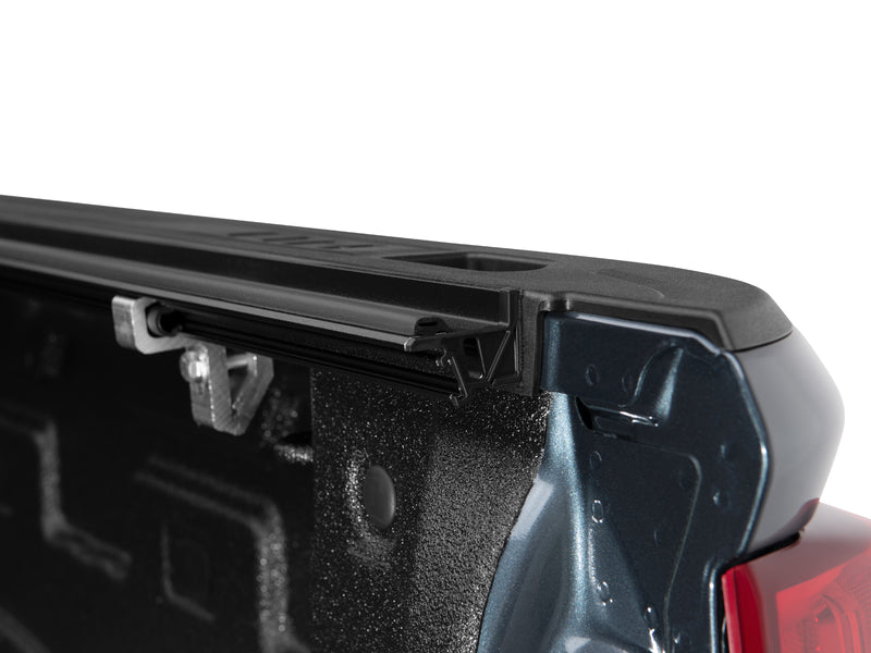 Close-up of the Flex side rail and end cap at the rear corner of the bed.