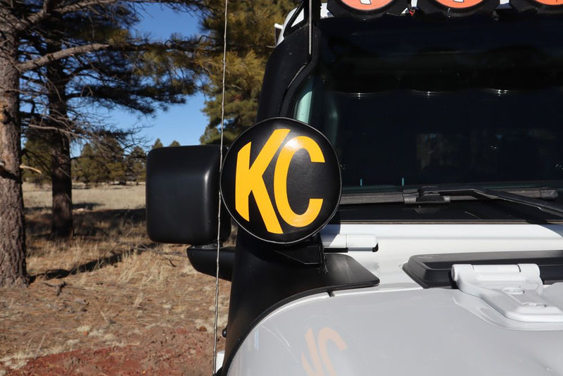 KC HiLiTES 6" Round Light Cover & Shield, KC soft cover with yellow logo on a Jeep A-pillar light