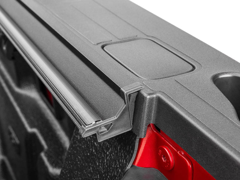 Close-up of the Select rear panel corner, end cap and the seal where the cover meets the bed rail.